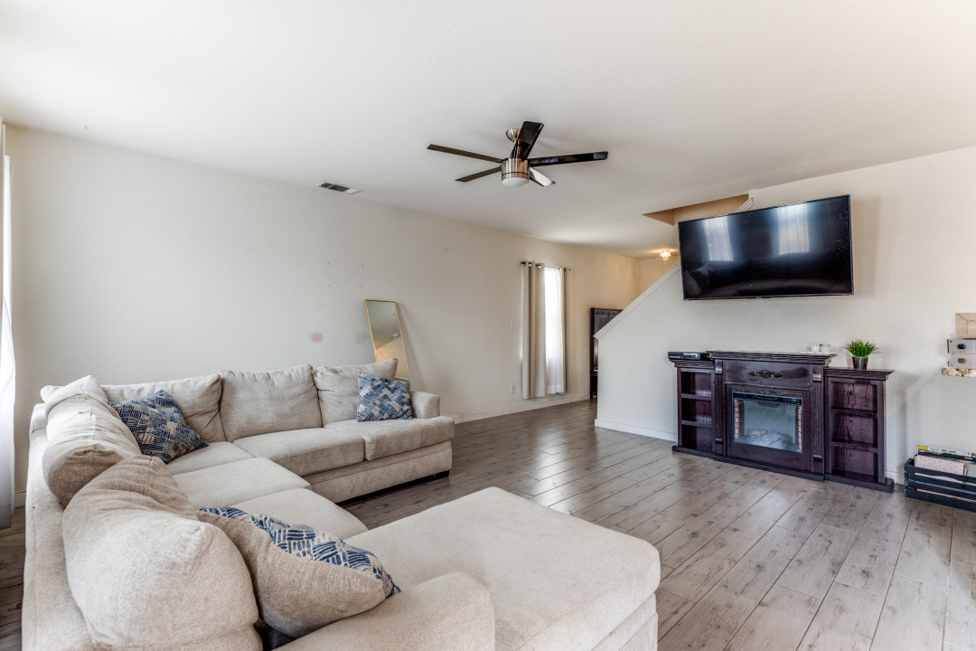 1524 Treeta Trail Kyle, TX 78640 - Photo 3 of 25 a living room with furniture and a flat screen tv