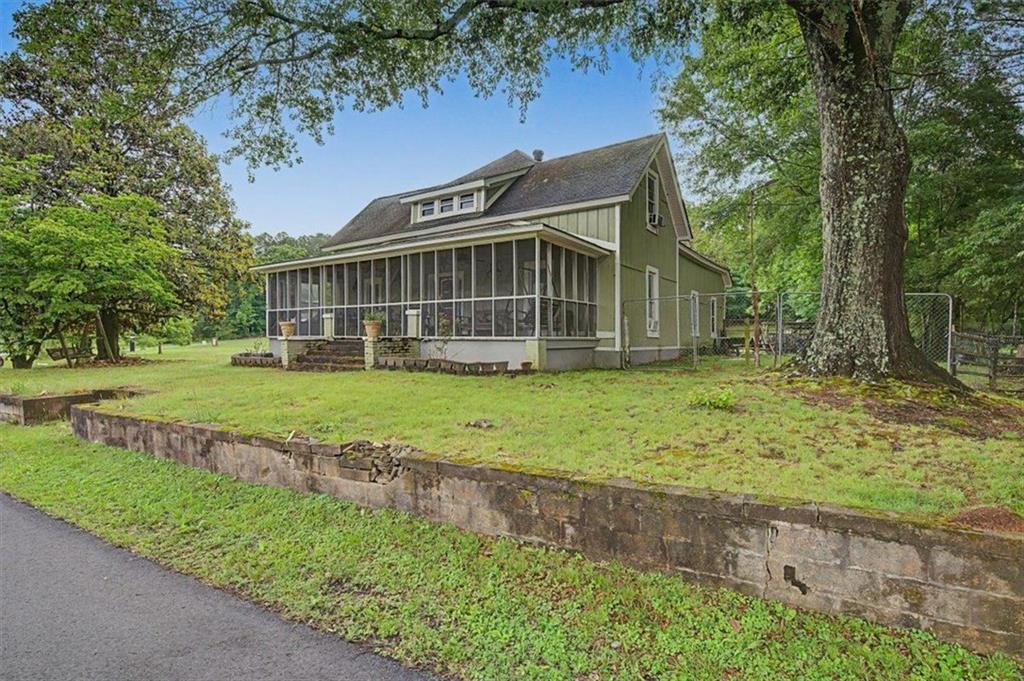 483 Coal Road Northwest Resaca, GA 30735 - Photo 4 of 56 a view of a house with a yard and sitting area