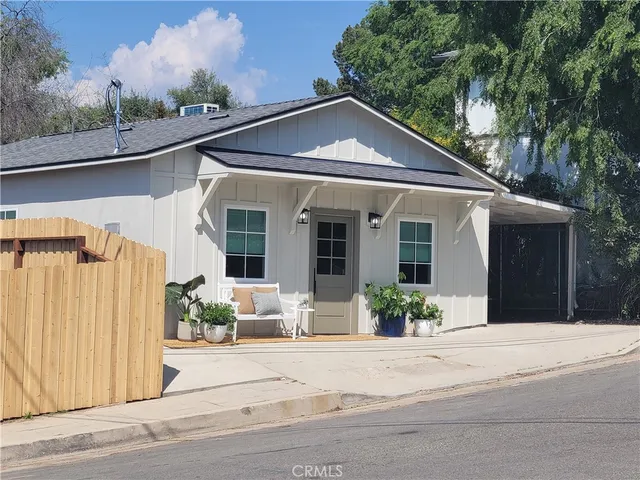a front view of a house with a porch