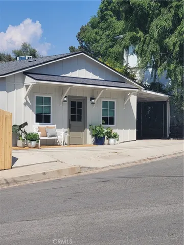 front view of a house with a small yard