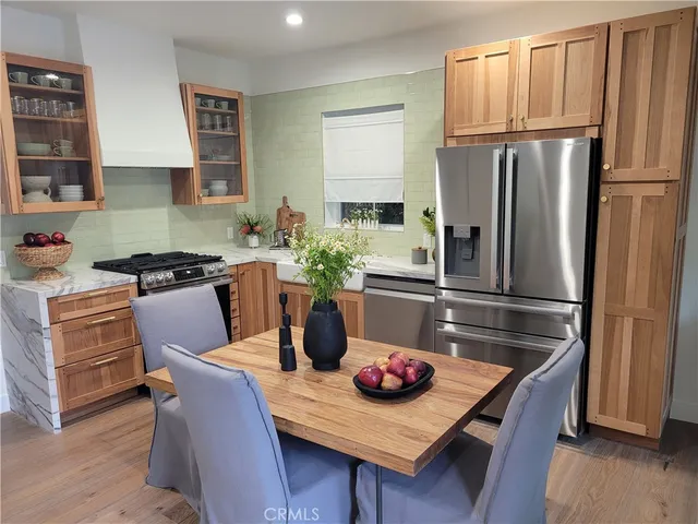 a bathroom with a granite countertop sink toilet a mirror and shower
