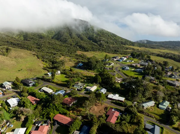 an aerial view of residential houses with outdoor space