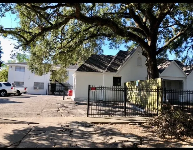 a view of a house with a snow in the yard