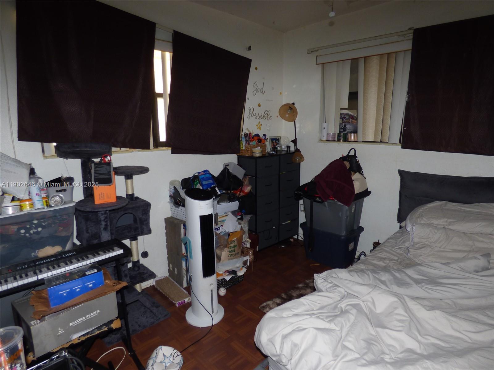 347 Northwest 42nd Street Miami, FL 33127 - Photo 11 of 11 a room with gym equipment and a mirror