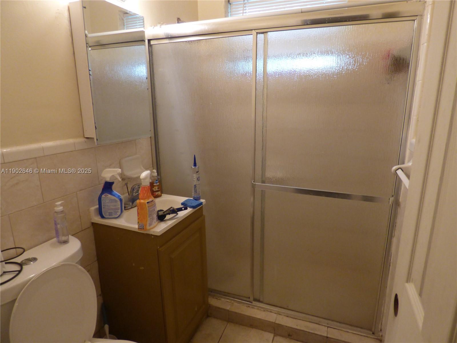 347 Northwest 42nd Street Miami, FL 33127 - Photo 4 of 11 a bathroom with a sink toilet and shower