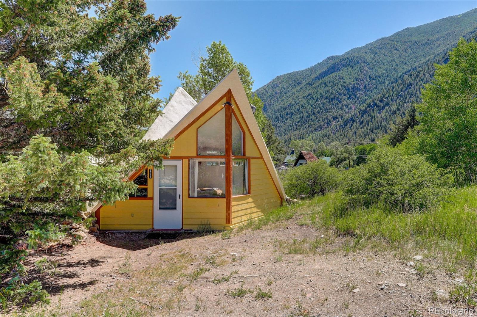 2212 Alvarado Road Georgetown, CO 80444 - Photo 17 of 19 a view of a house with backyard and trees