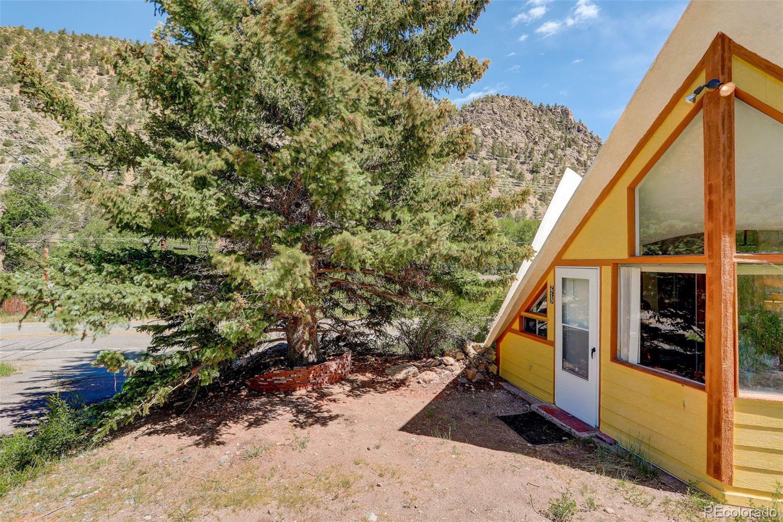 2212 Alvarado Road Georgetown, CO 80444 - Photo 18 of 19 a view of a house with backyard and trees