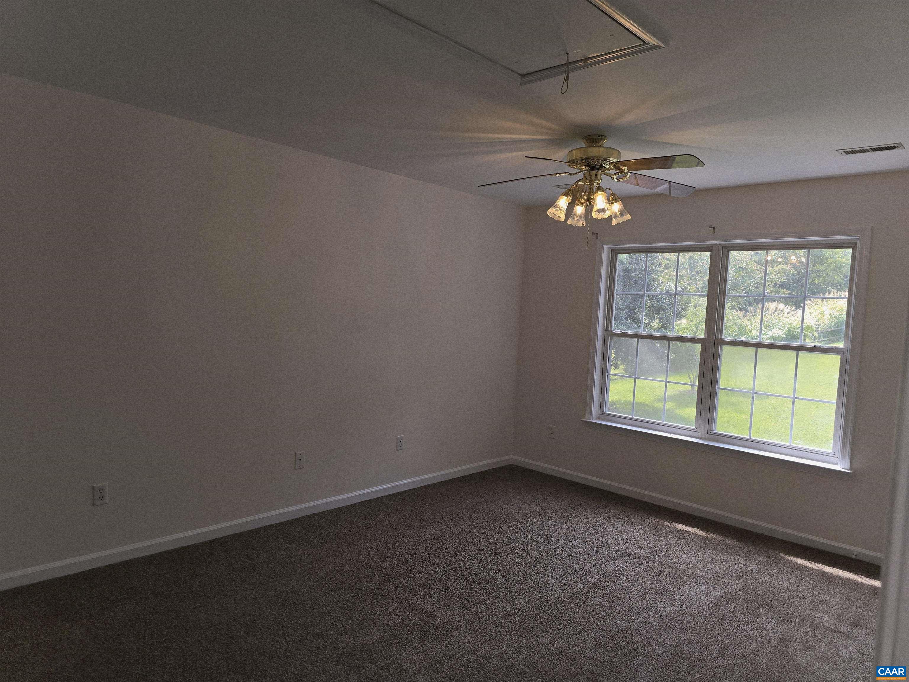 259 Spring Oaks Lane Ruckersville, VA 22968 - Photo 16 of 26 an empty room with a window and a fan