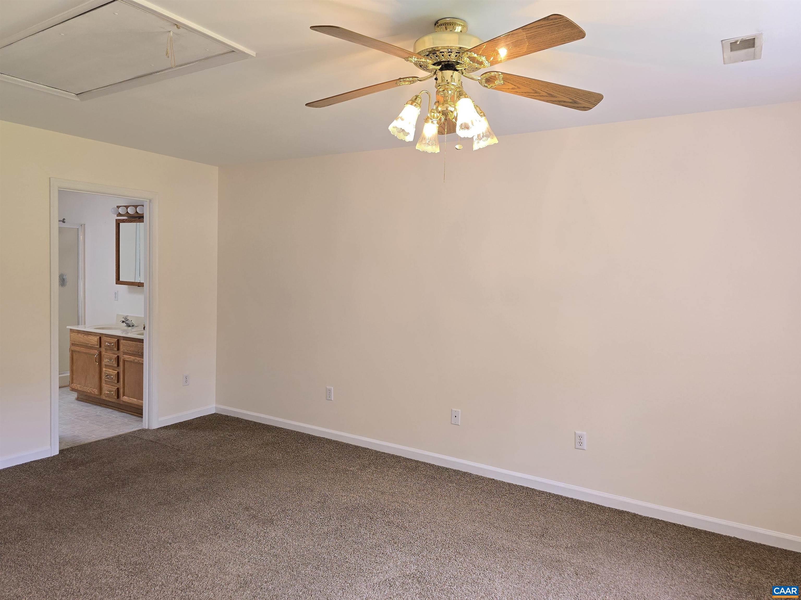 259 Spring Oaks Lane Ruckersville, VA 22968 - Photo 18 of 26 an empty room with a chandelier fan