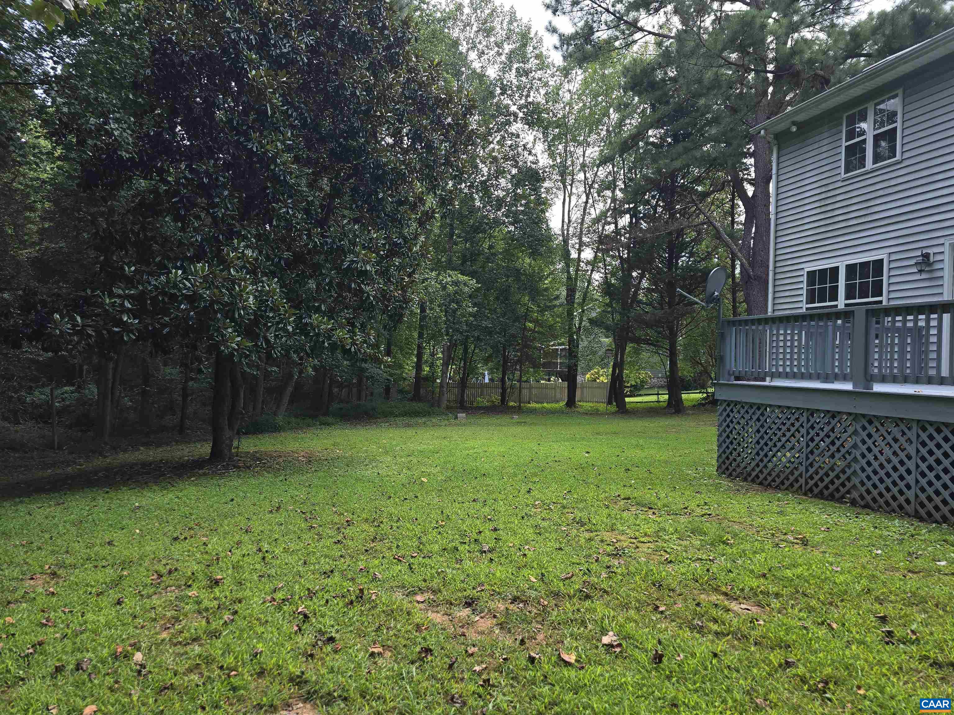 259 Spring Oaks Lane Ruckersville, VA 22968 - Photo 5 of 26 a view of a backyard with a small cabin
