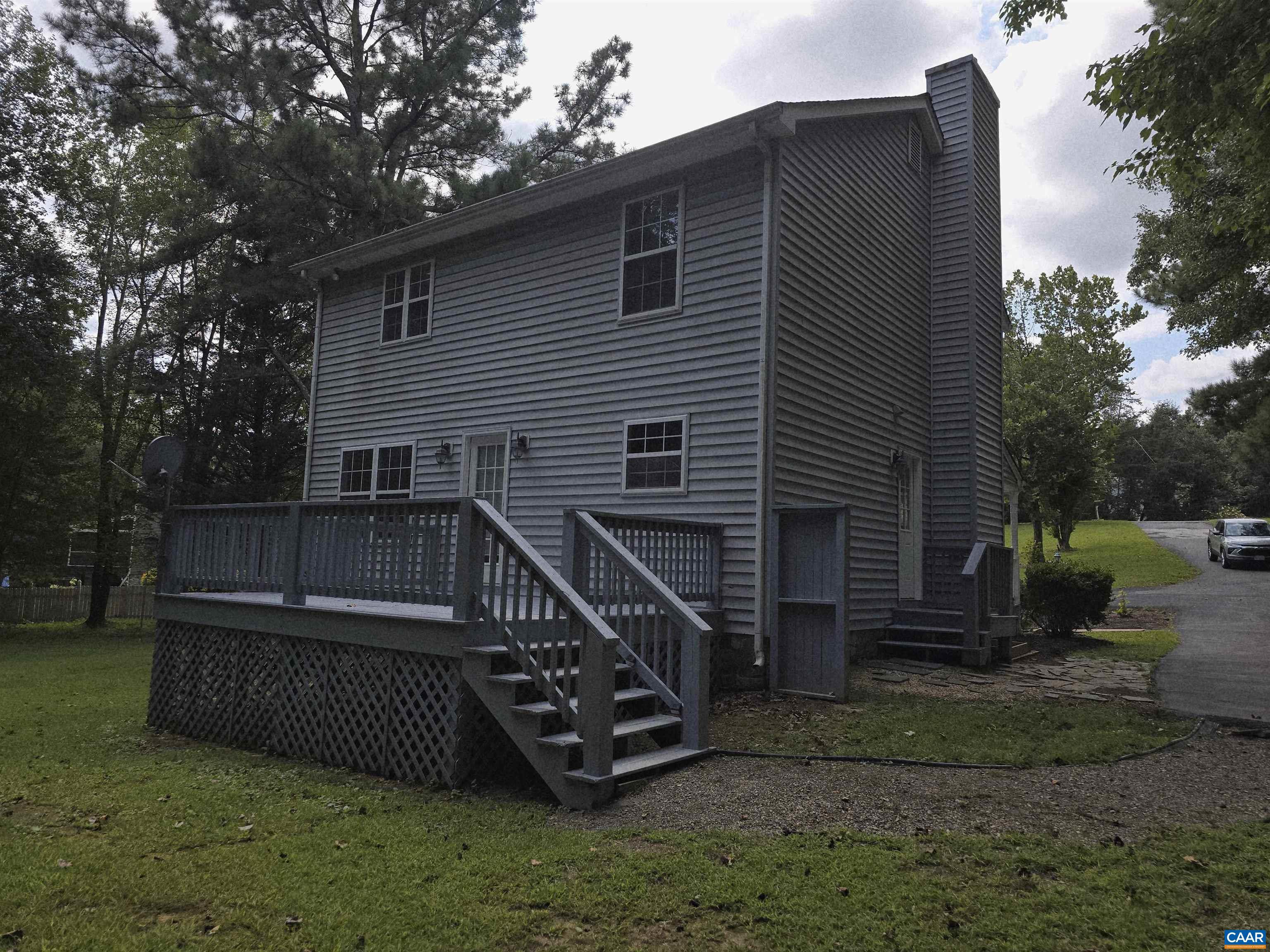 259 Spring Oaks Lane Ruckersville, VA 22968 - Photo 6 of 26 a view of a house with a yard