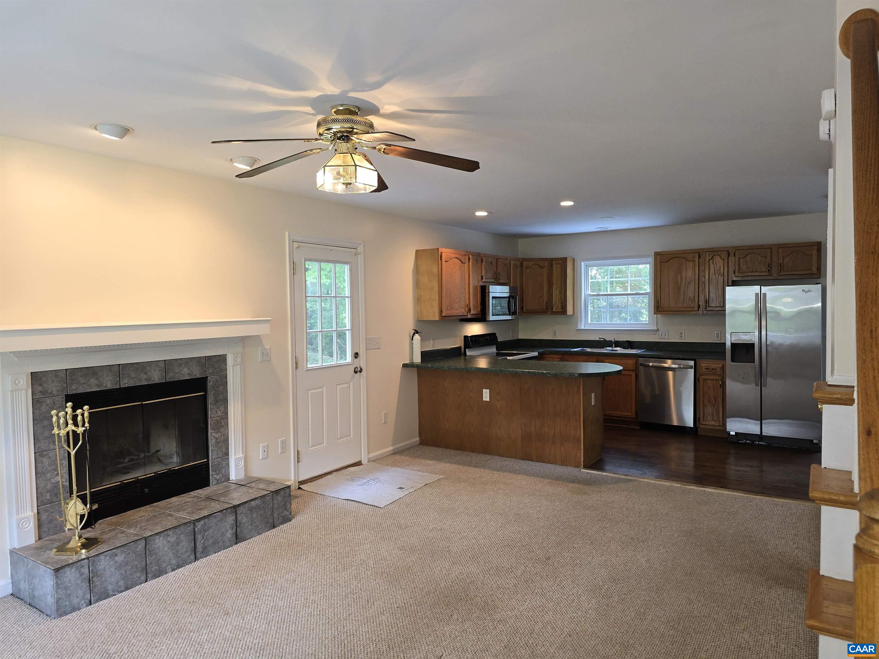259 Spring Oaks Lane Ruckersville, VA 22968 - Photo 9 of 26 a kitchen with stainless steel appliances granite countertop a stove a sink and a refrigerator