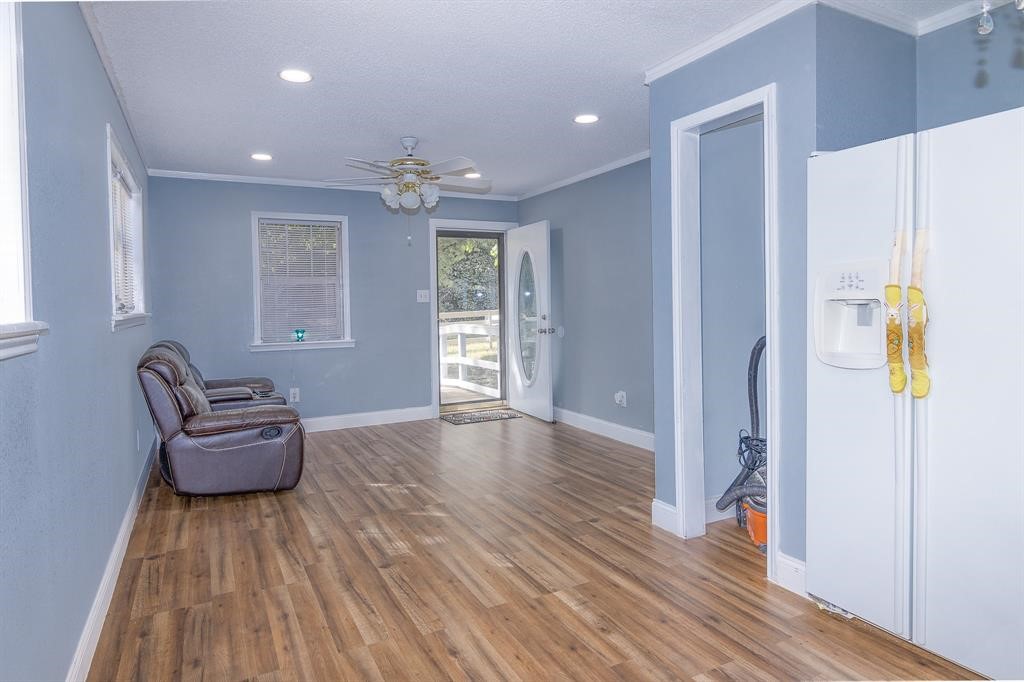 285 Debbies Boulevard Livingston, TX 77351 - Photo 5 of 10 a living room with furniture and a wooden floor
