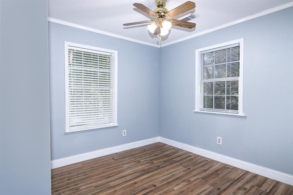 285 Debbies Boulevard Livingston, TX 77351 - Photo 9 of 10 a view of an empty room with wooden floor and a window