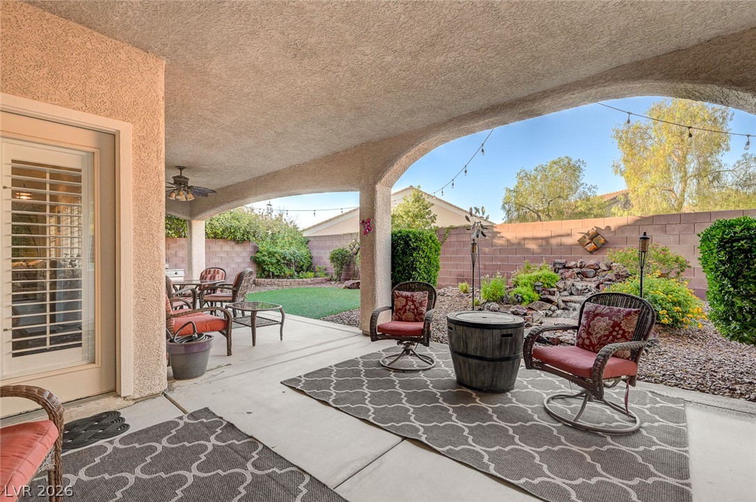 1604 Cattle Ranch Place Henderson, NV 89002 - Photo 69 of 99 An inviting covered patio offers a comfortable space for outdoor relaxation and entertainment.