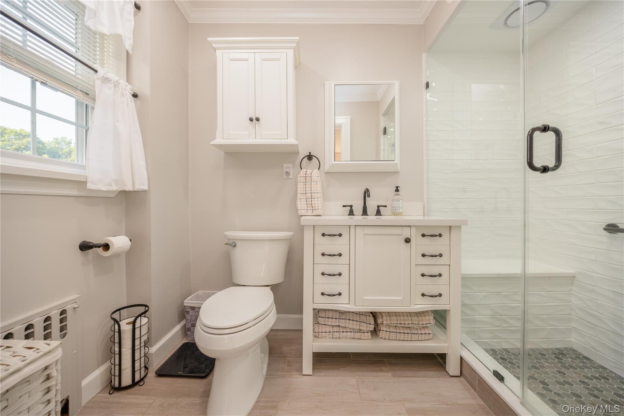 159 Fenimore Road New Rochelle, NY 10804 - Photo 19 of 37 Newly remodeled primary bathroom with walk-in shower