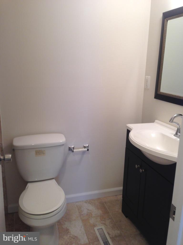 88 Leeland Road Fredericksburg, VA 22405 - Photo 14 of 22 a bathroom with a toilet and a sink