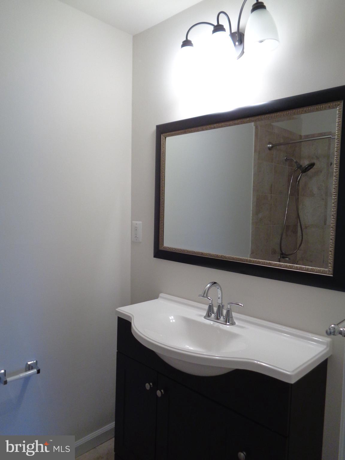 88 Leeland Road Fredericksburg, VA 22405 - Photo 15 of 22 a bathroom with a sink and a mirror