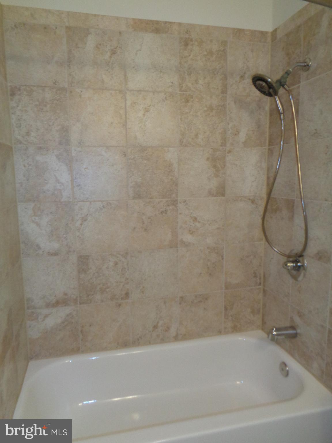 88 Leeland Road Fredericksburg, VA 22405 - Photo 17 of 22 a bathroom with a bath tub and a shower