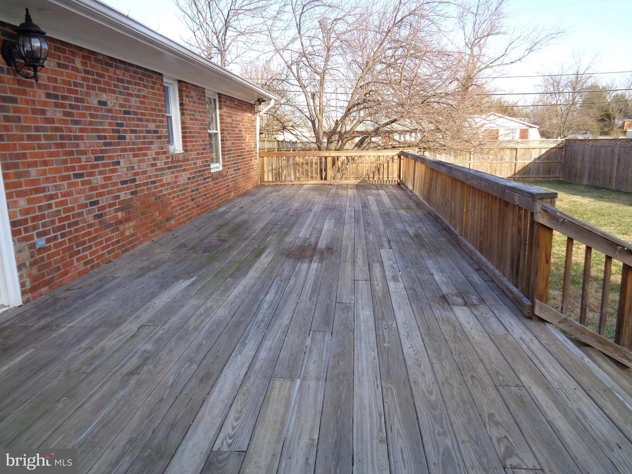 88 Leeland Road Fredericksburg, VA 22405 - Photo 18 of 22 a view of deck with wooden floor and fence