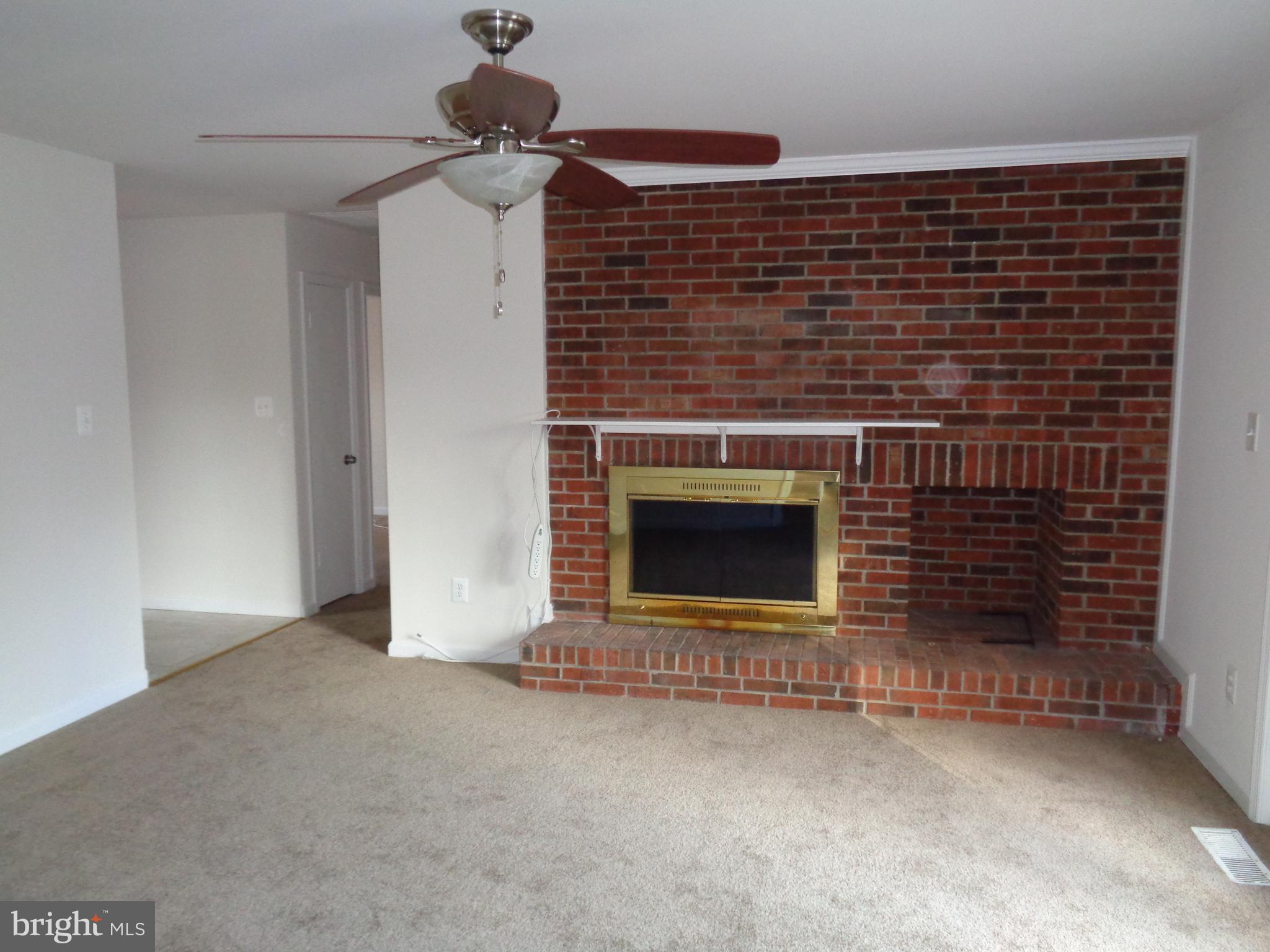 88 Leeland Road Fredericksburg, VA 22405 - Photo 4 of 22 a view of a livingroom with a fireplace