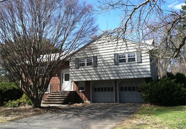 239 Worthen Road East Lexington, MA 02421 - Photo 2 of 13 a front view of a house with a yard