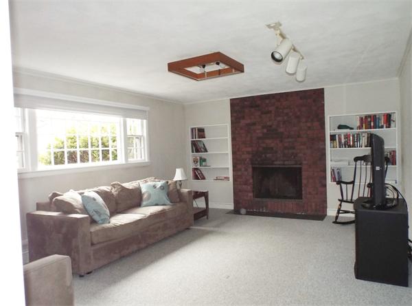239 Worthen Road East Lexington, MA 02421 - Photo 8 of 13 a living room with furniture and a fireplace