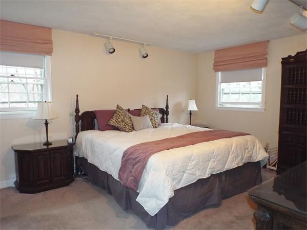 239 Worthen Road East Lexington, MA 02421 - Photo 9 of 13 a bedroom with a bed and window
