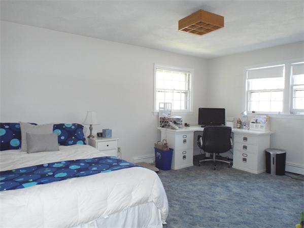 239 Worthen Road East Lexington, MA 02421 - Photo 10 of 13 a bedroom with a bed and a desk