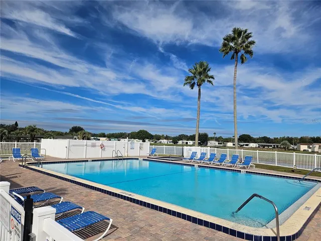 a view of a swimming pool with a chair