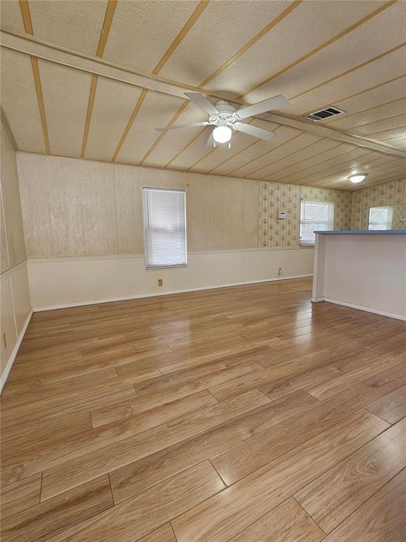 481 Chickadee Court Plant City, FL 33565 - Photo 3 of 17 a view of a room with wooden floor