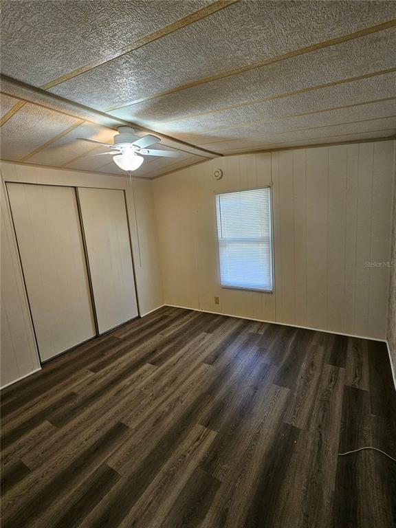 481 Chickadee Court Plant City, FL 33565 - Photo 7 of 17 a view of empty room with wooden floor