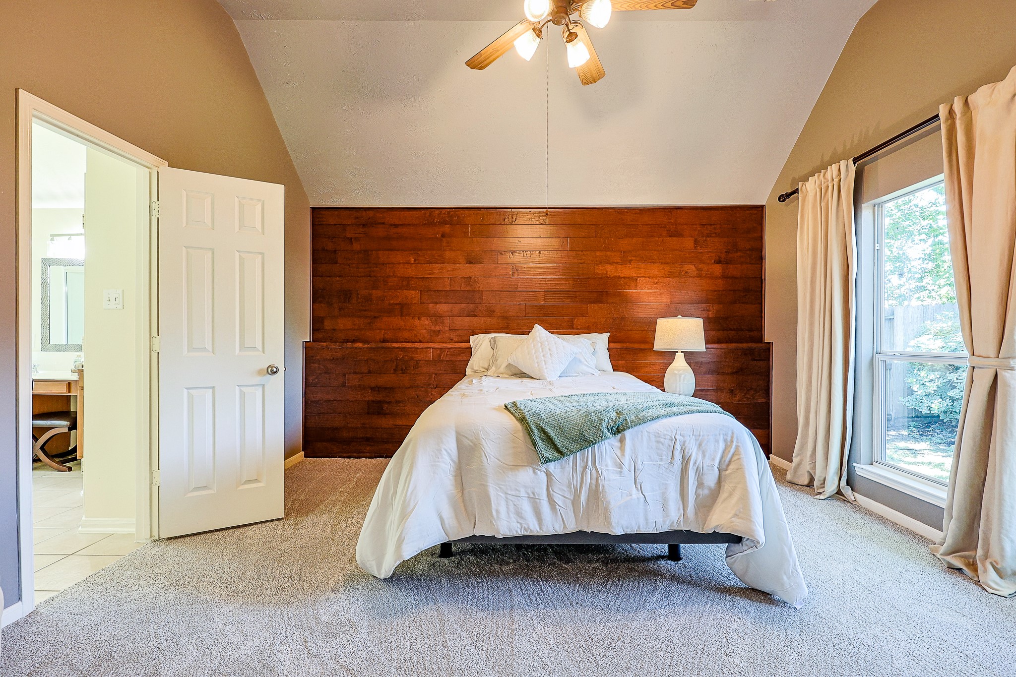 10306 Rudolph Court Missouri City, TX 77459 - Photo 16 of 34 Dramatic vaulted ceilings elevate the space, giving the room an incredibly open and airy feel. Upgraded with new plush, premium neutral carpet underfoot that delivers ultimate comfort and excellent sound dampening.