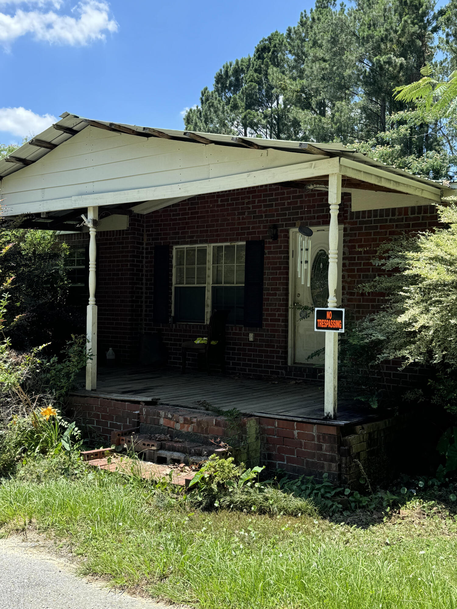 7871 Highway 4 Jay, FL 32565 - Photo 3 of 10 a front view of a house with garden