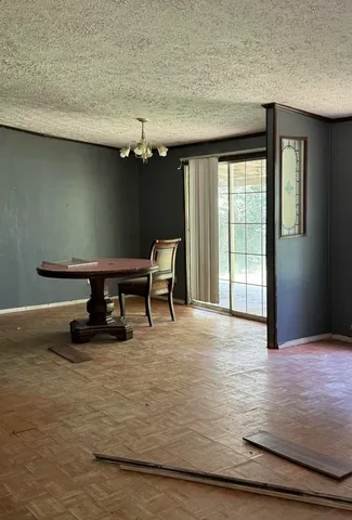 a view of a room with furniture and windows