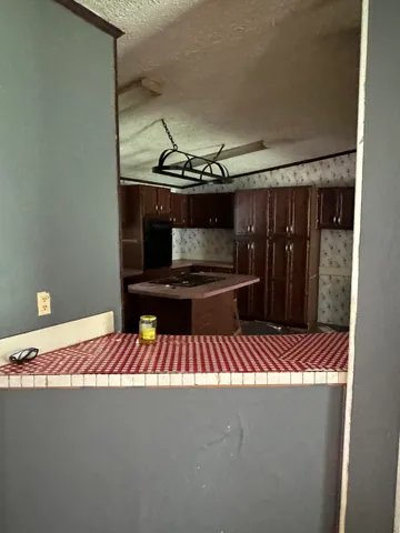 a bedroom with a bed and ceiling fan