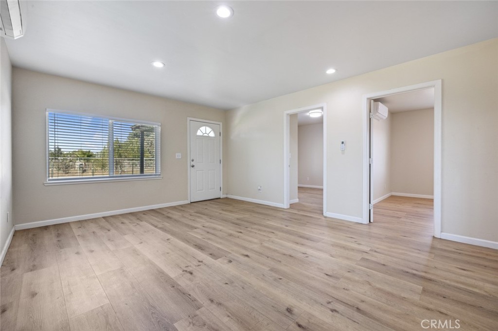 19247 3rd Stevinson, CA 95374 - Photo 11 of 50 a view of an empty room with wooden floor and window