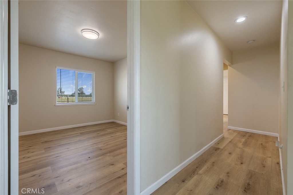 19247 3rd Stevinson, CA 95374 - Photo 20 of 50 an empty room with wooden floor and windows