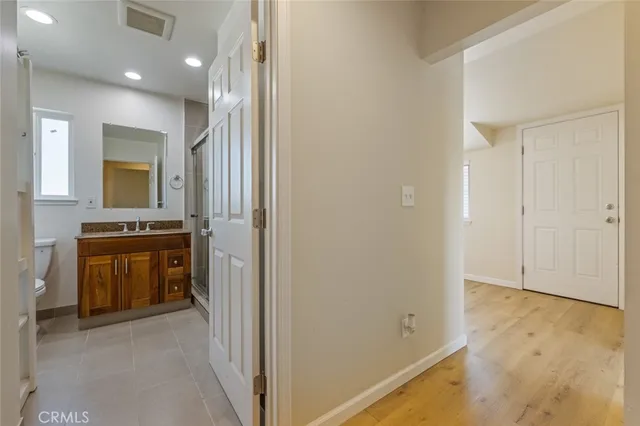 a view of walk in closet with living room