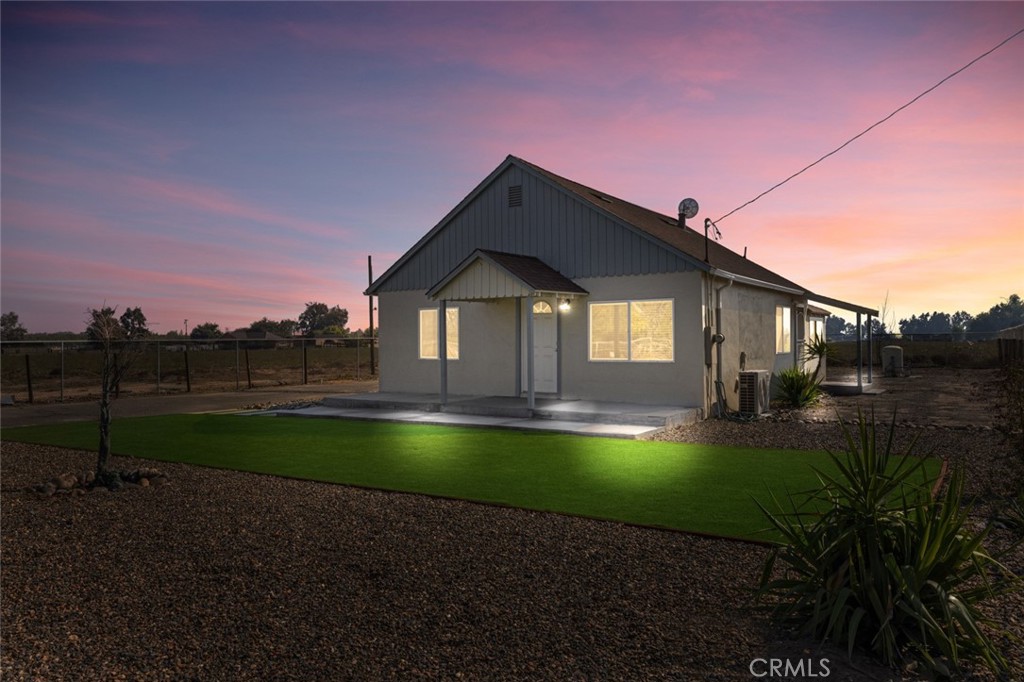 19247 3rd Stevinson, CA 95374 - Photo 3 of 50 a front view of a house with yard and lake view