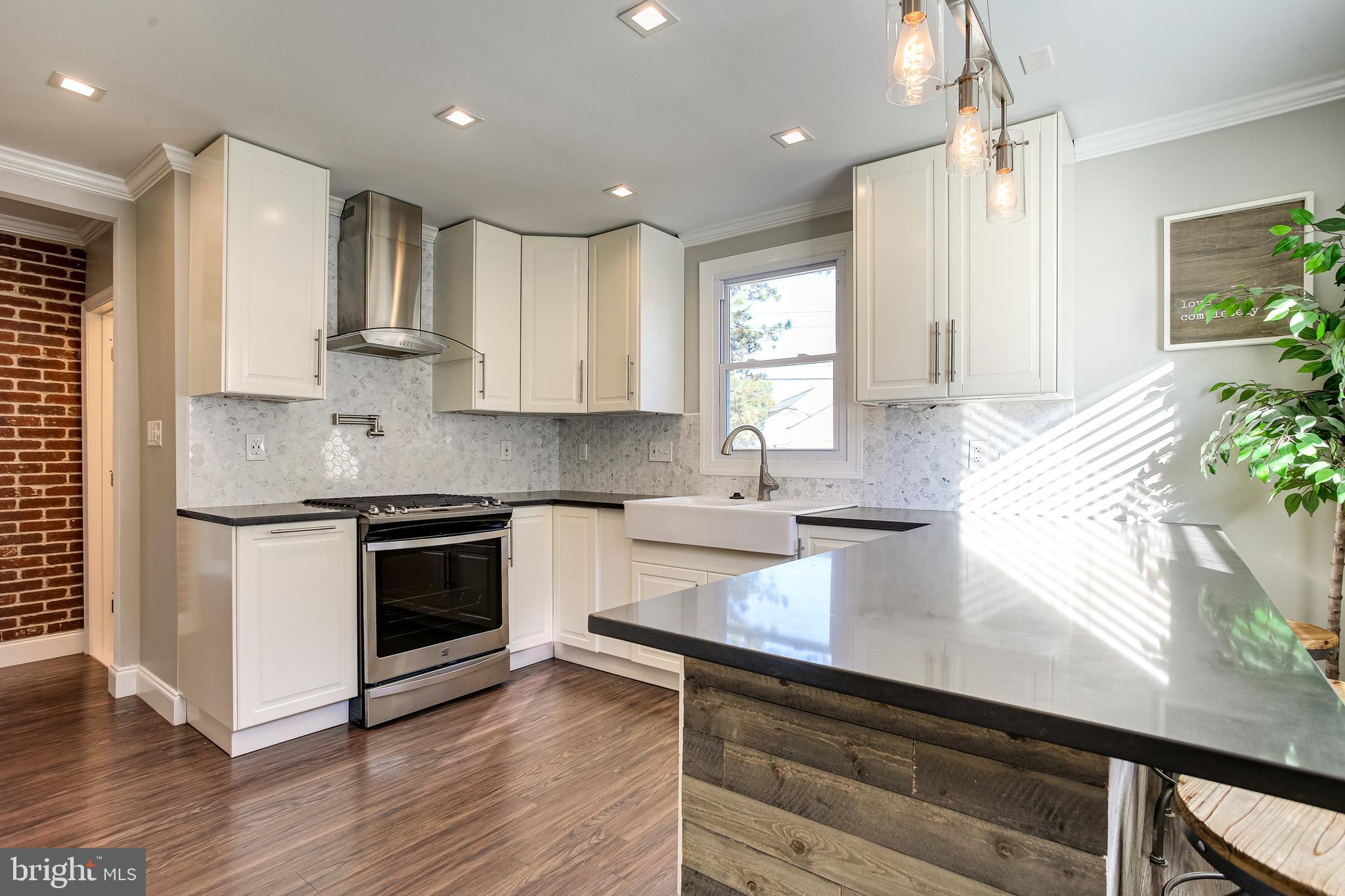 2605 Lynbrook Road Baltimore, MD 21222 - Photo 5 of 34 Kitchen w/ Tile Backsplash, Recessed & Pendant Ltg