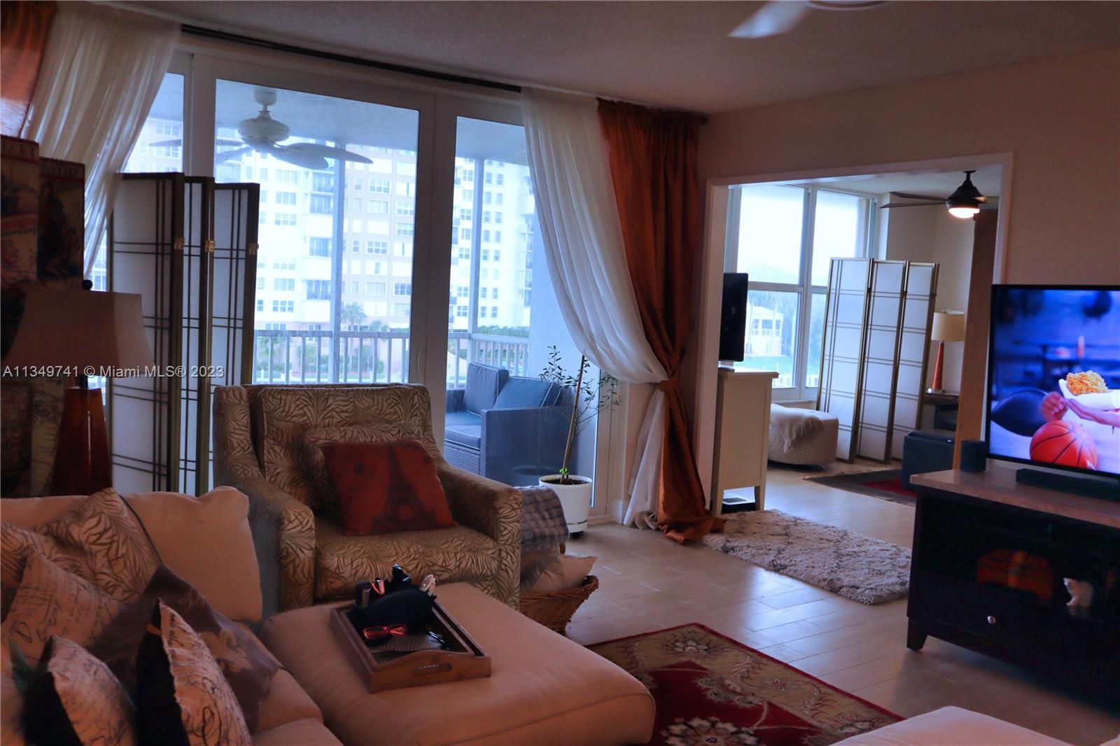 Lighthouse Point Lighthouse Point, FL 33064 - Photo 12 of 52 a living room with furniture and a flat screen tv