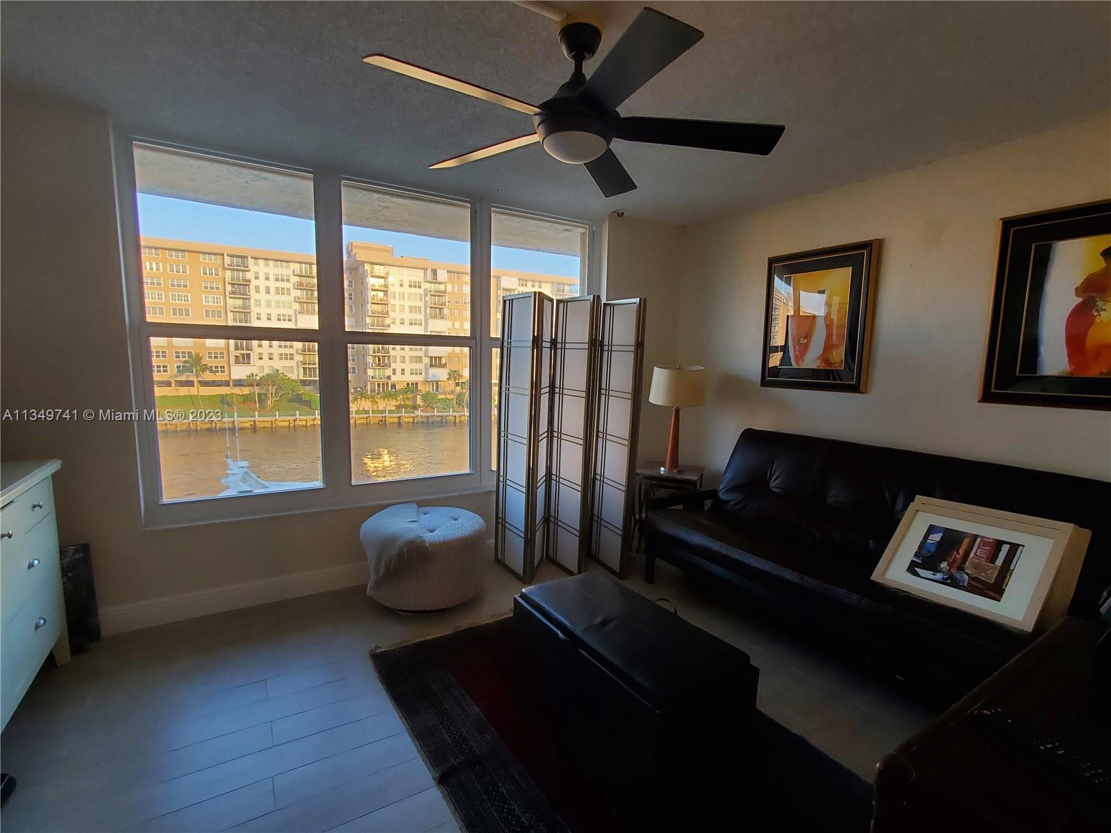 Lighthouse Point Lighthouse Point, FL 33064 - Photo 15 of 52 a living room with furniture and a window