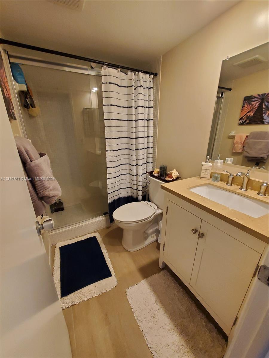 Lighthouse Point Lighthouse Point, FL 33064 - Photo 17 of 52 a bathroom with a sink toilet and shower