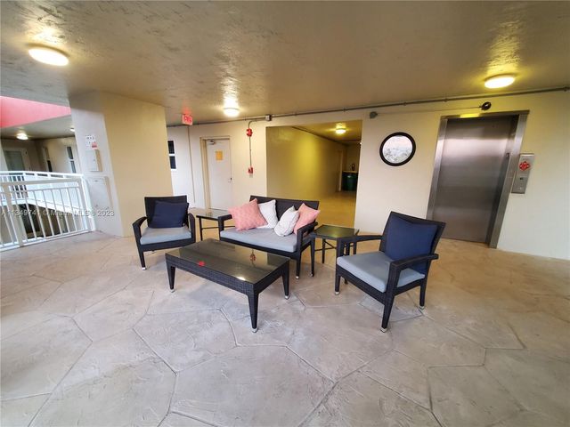 a balcony with wooden floor and city view