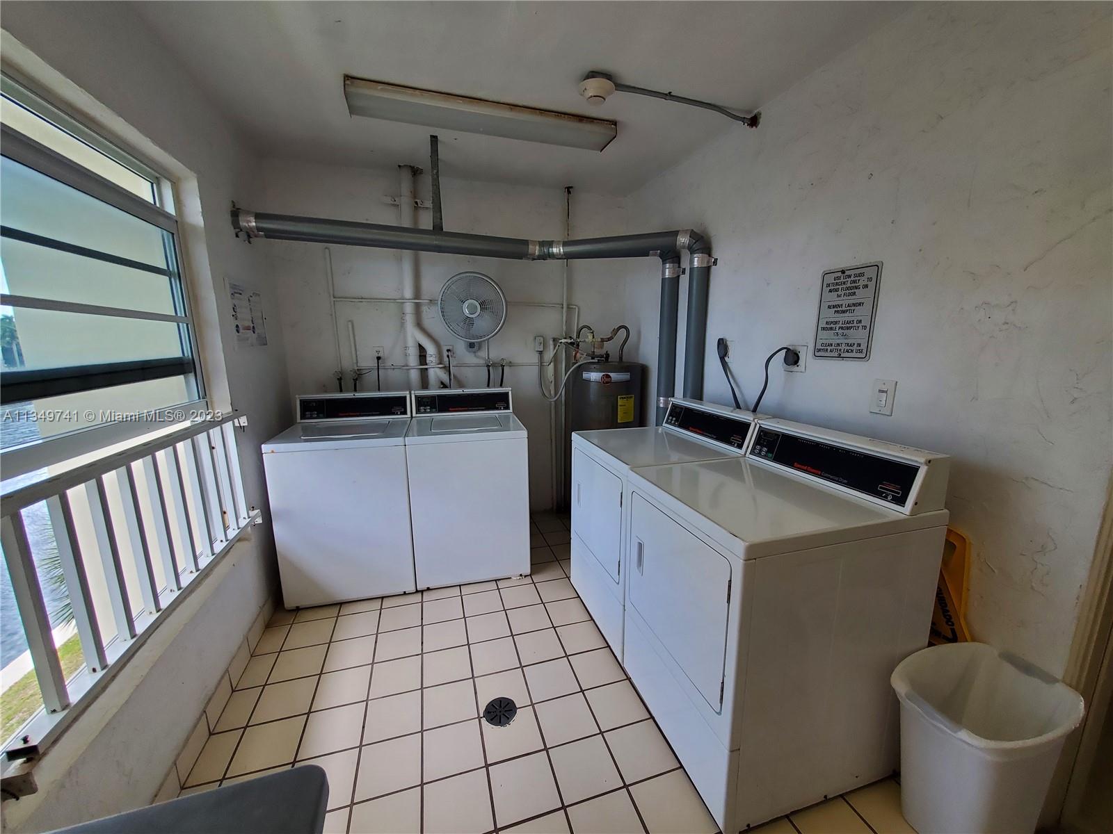 Lighthouse Point Lighthouse Point, FL 33064 - Photo 27 of 52 a kitchen with a sink and cabinets