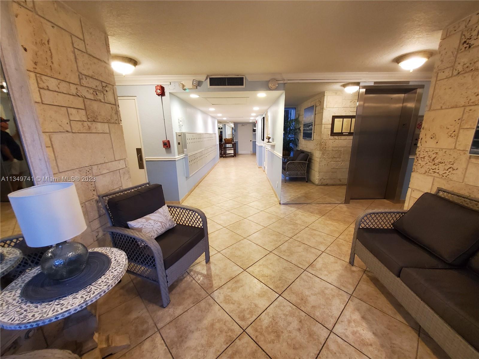 Lighthouse Point Lighthouse Point, FL 33064 - Photo 29 of 52 a living room with furniture and a walk in closet