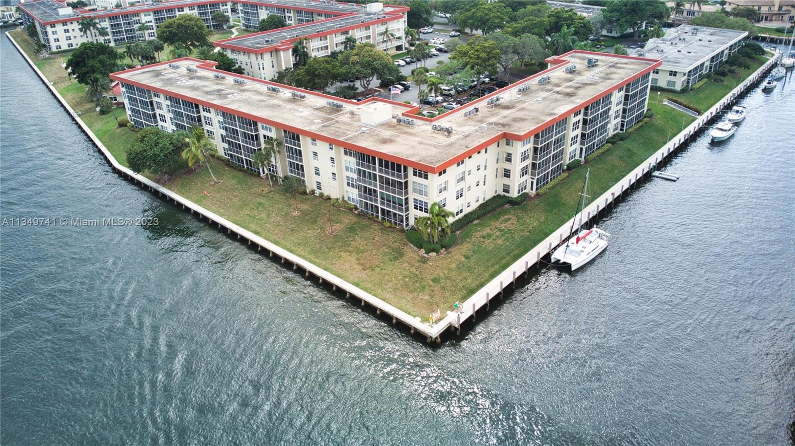 Lighthouse Point Lighthouse Point, FL 33064 - Photo 39 of 52 a view of a balcony with two chairs and a wooden fence