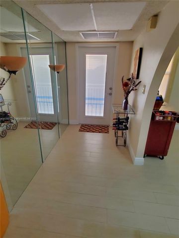 a view of a livingroom with furniture and staircase