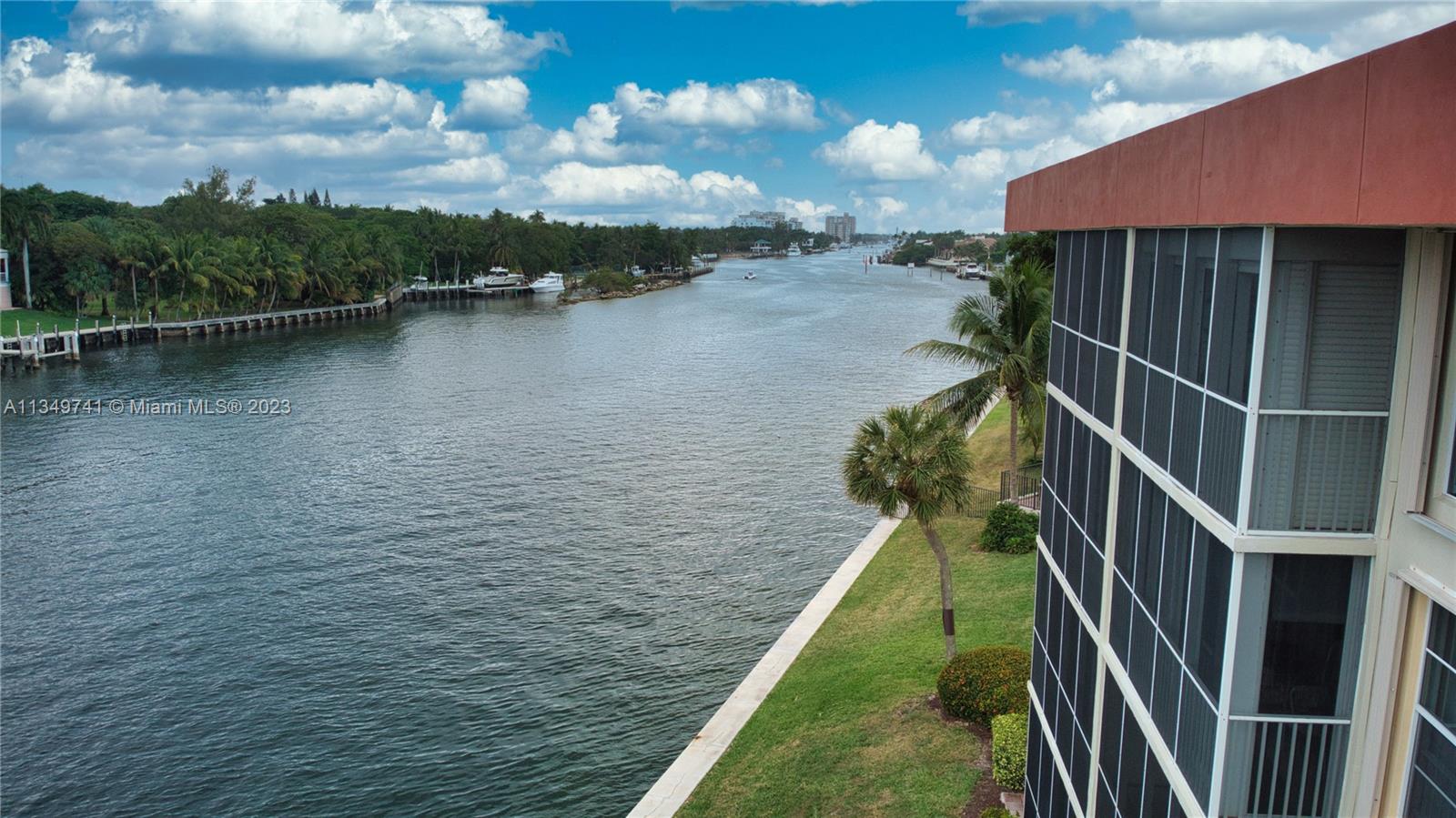 Lighthouse Point Lighthouse Point, FL 33064 - Photo 45 of 52 a view of a lake with a floor to ceiling window and brick wall